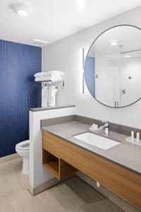 a bathroom with a sink and a mirror at Fairfield Inn & Suites by Marriott San Diego Pacific Beach in San Diego