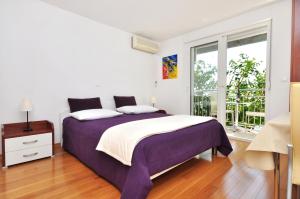 Apartments Zanic on The Beach客房内的一张或多张床位