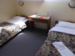 Postel nebo postele na pokoji v ubytování Hotel Tukums