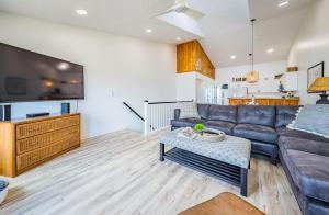 a living room with a couch and a table at OCTIPI Your SenSEAS in Kitty Hawk