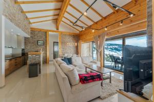 a living room with a couch and a table at Vila Cigota Zlatibor in Zlatibor