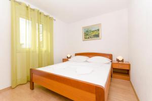 Posteľ alebo postele v izbe v ubytovaní Apartments Klisovic