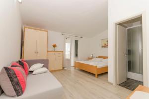 Posteľ alebo postele v izbe v ubytovaní Apartments Klisovic