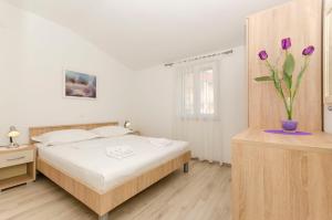Posteľ alebo postele v izbe v ubytovaní Apartments Klisovic