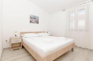 Posteľ alebo postele v izbe v ubytovaní Apartments Klisovic