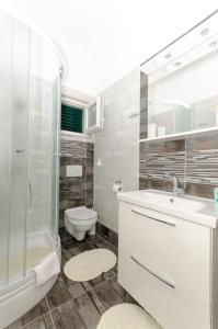 Kúpeľňa v ubytovaní Apartments Klisovic