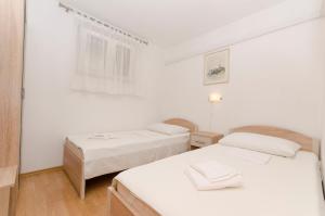 Posteľ alebo postele v izbe v ubytovaní Apartments Klisovic