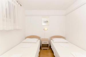 Posteľ alebo postele v izbe v ubytovaní Apartments Klisovic