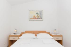 Posteľ alebo postele v izbe v ubytovaní Apartments Klisovic