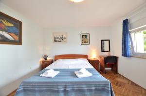 Postel nebo postele na pokoji v ubytování Apartment Visnja