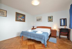 Postel nebo postele na pokoji v ubytování Apartment Visnja