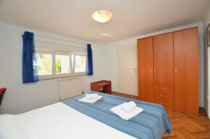 Postel nebo postele na pokoji v ubytování Apartment Visnja