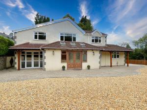 a large white house with a driveway at Big House in countryside near Cardiff in Rudry