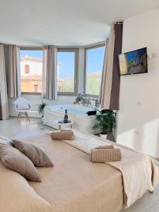 a large bedroom with a large bed with pillows on it at Seaside Home in Posada