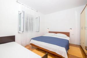 Posteľ alebo postele v izbe v ubytovaní Apartment Adriatico