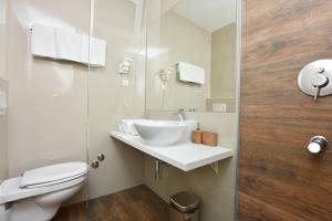 a bathroom with a sink and a toilet at Apartments Ivanovic in Budva +61 photos