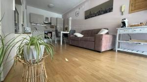 a living room with a couch and a table at Civico 32 in Montalto Dora