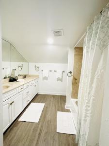 a bathroom with a sink and a shower at Gulf Front Penthouse Condo in Pensacola Beach