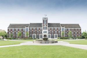 a large brick building with a fountain in front of it at University Apartment • Sleeps 8 in Loughborough