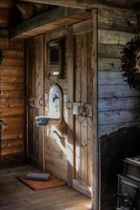 a wooden room with a mirror on the wall at Cabane de l'R-mitage in Modave