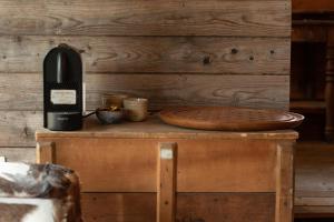 a wine bottle sitting on top of a wooden table at Cabane de l'R-mitage in Modave