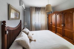 Posteľ alebo postele v izbe v ubytovaní Sevilla Aljarafe Home.