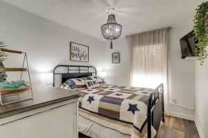 a bedroom with a bed with a comforter at Spa On Port Royal Sound 2217 in Hilton Head Island +33 photos