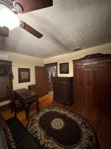 a living room with a couch and a table at The Queen's Gambit ( A Luxury 2nd Floor Apt in Downtown Staunton) in Staunton