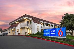 a building with a sign in front of it at Motel 6-Carpinteria, CA - Santa Barbara - South in Carpinteria