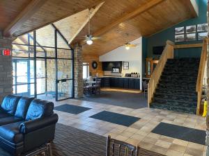 a living room with a couch and a staircase at Motel 6 Norway MI in Norway