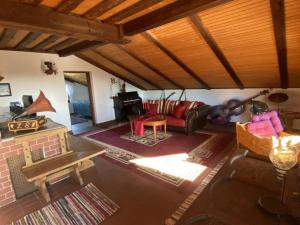 an overhead view of a living room with a fireplace at Cozy holiday home in Paldau in a charming area in Paldau