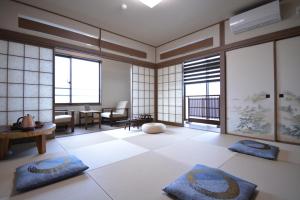 a living room with two pillows on the floor at Shirahama no Yado Daigo in Shirahama