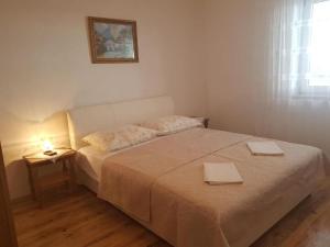 Łóżko lub łóżka w pokoju w obiekcie Apartment Tomljanovic