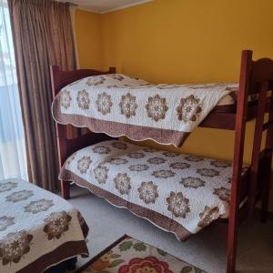 Ένα ή περισσότερα κρεβάτια σε δωμάτιο στο Condominio Altos de Mirasol II