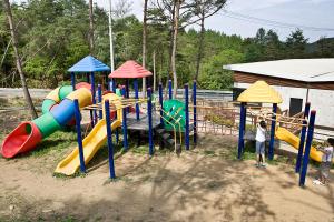 a group of children playing on a playground at Hyundai Soo Resort Hoengseong in Pyeongchang