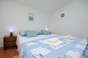 Posteľ alebo postele v izbe v ubytovaní Apartments Jasminka