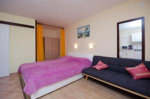 Posteľ alebo postele v izbe v ubytovaní Apartments Jasminka