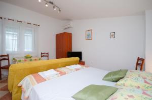 Posteľ alebo postele v izbe v ubytovaní Apartments Jasminka