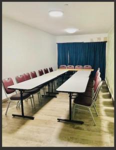 a conference room with a long table and chairs at Hollywood Beach Hotels in Hollywood