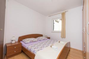 Postel nebo postele na pokoji v ubytování Apartments Mira
