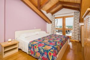 Postel nebo postele na pokoji v ubytování Apartment Zlendic