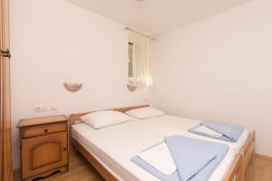 Postel nebo postele na pokoji v ubytování Apartments Mira