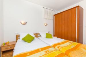 Postel nebo postele na pokoji v ubytování Apartments Mira
