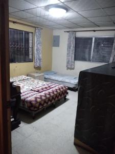 Un ou plusieurs lits dans un hébergement de l'établissement PaCasa Hostel