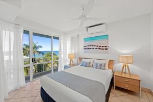 Ένα ή περισσότερα κρεβάτια σε δωμάτιο στο La Mer Sunshine Beachfront +99 φωτογραφίες