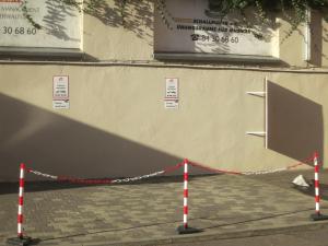 a curb with a red and white rope around a building at Berlinapartments-Downtown in Berlin