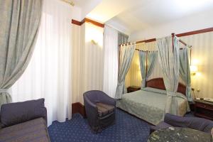 Voodi või voodid majutusasutuse Hotel Miro' toas