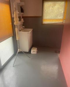 a bathroom with a sink and a washing machine at FRIENDS in Futae