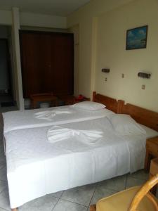 Postel nebo postele na pokoji v ubytování Karis Hotel
