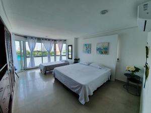 Postel nebo postele na pokoji v ubytování Torres del lago Pegasus Group Cartagena